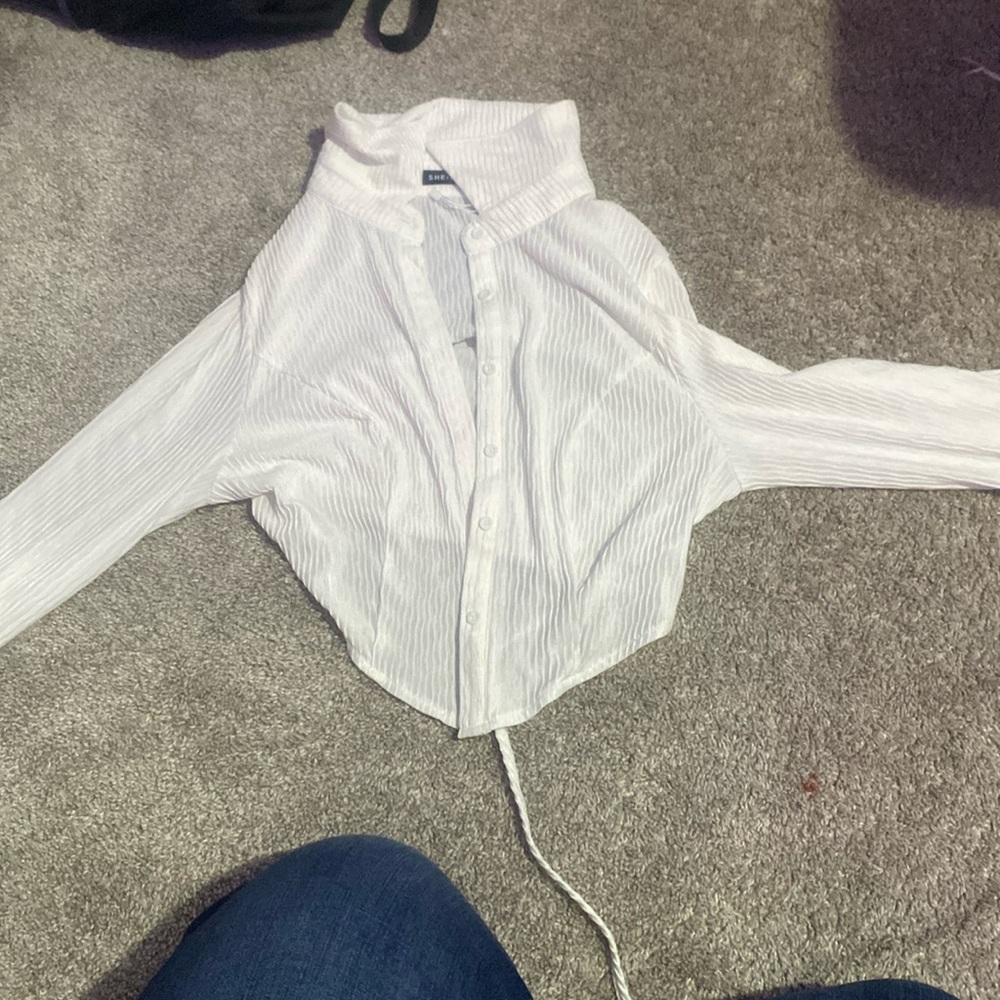 Meant to be styled over some kind of crop top, never worn